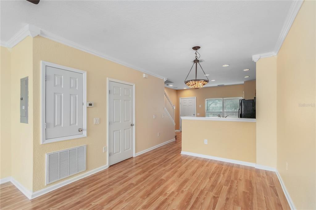4814 Southwest 44th Circle Ocala, FL 34474 - Photo 11 of 40 a view of a room with wooden floor and a ceiling fan