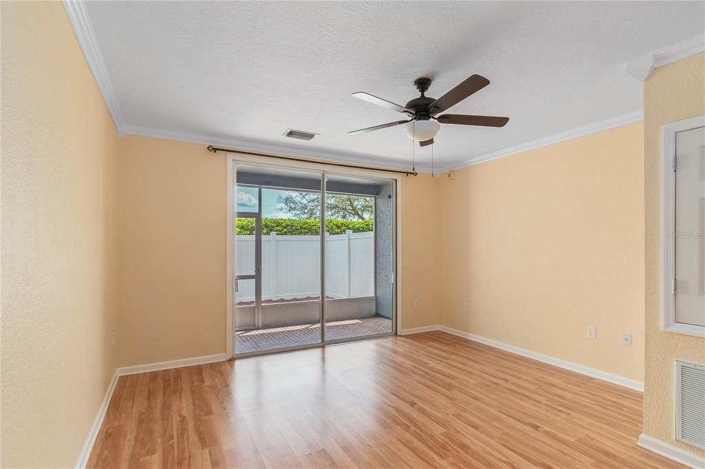 4814 Southwest 44th Circle Ocala, FL 34474 - Photo 12 of 40 an empty room with wooden floor and windows
