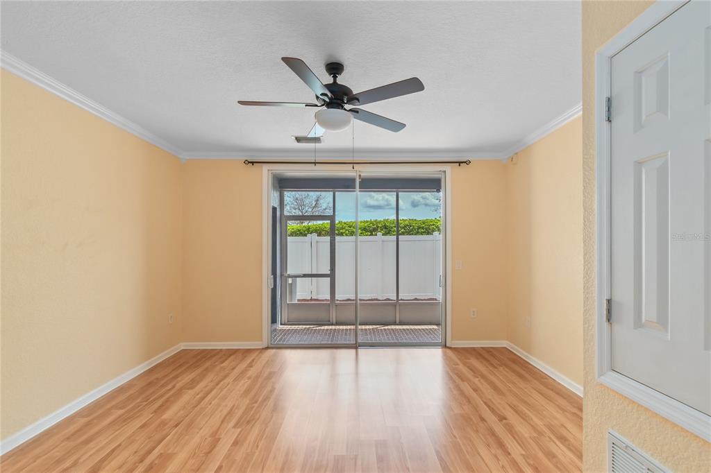 4814 Southwest 44th Circle Ocala, FL 34474 - Photo 13 of 40 a view of an empty room with wooden floor and a window