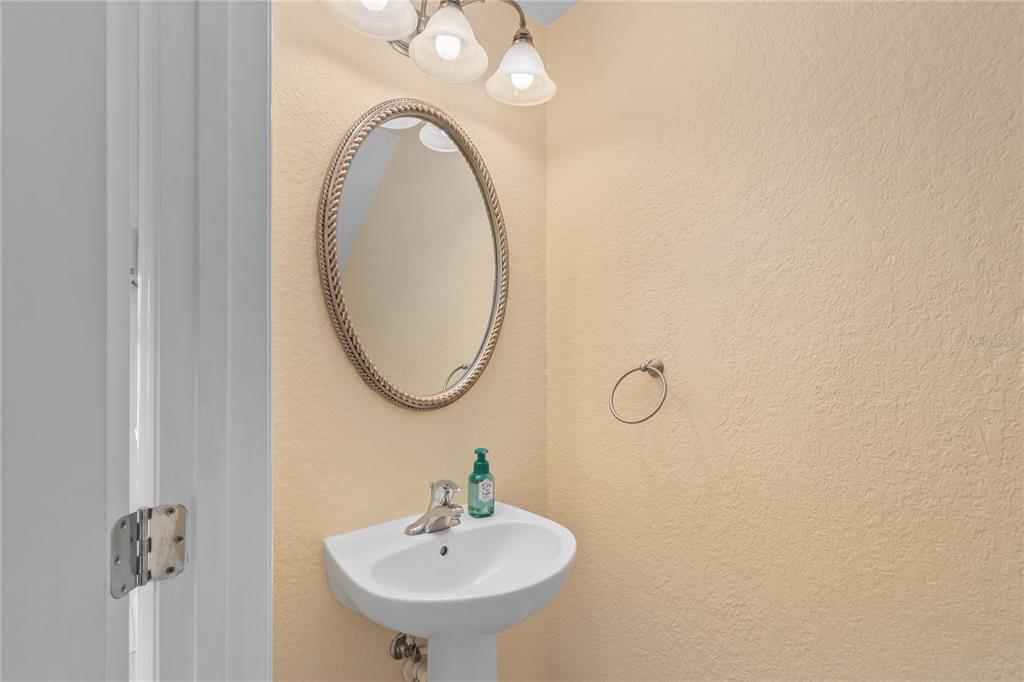 4814 Southwest 44th Circle Ocala, FL 34474 - Photo 16 of 40 a bathroom with a sink and mirror