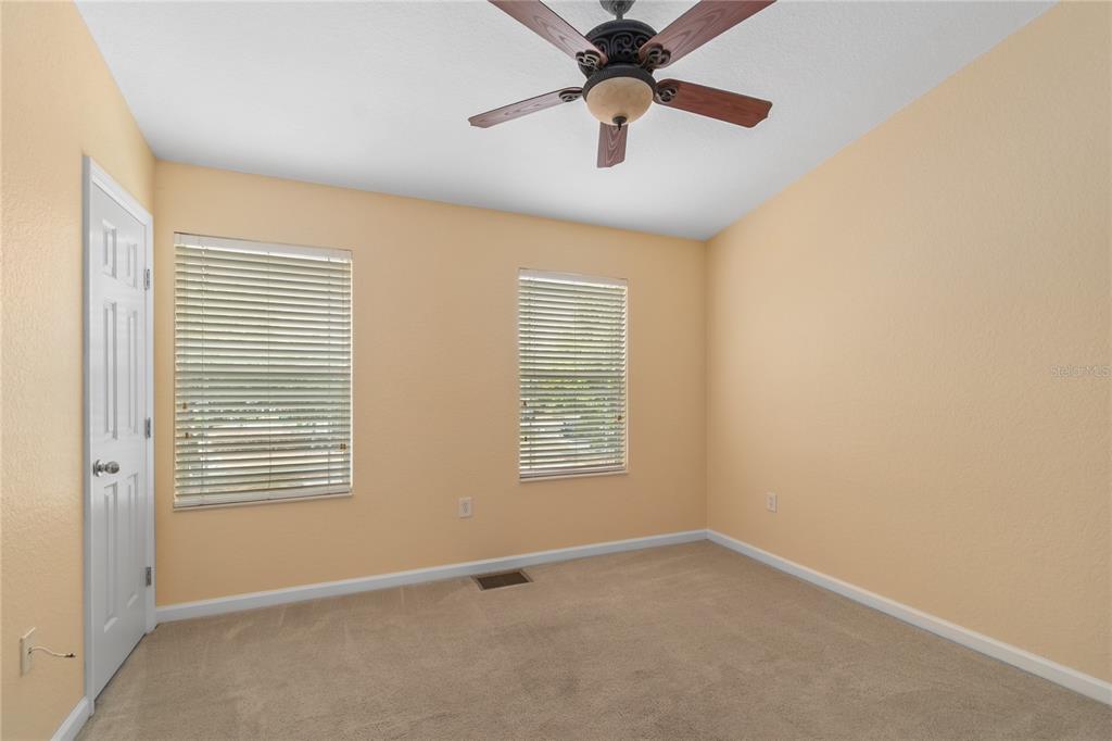 4814 Southwest 44th Circle Ocala, FL 34474 - Photo 17 of 40 an empty room with windows and fan
