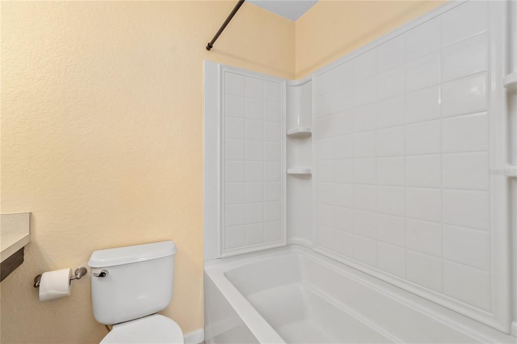 4814 Southwest 44th Circle Ocala, FL 34474 - Photo 21 of 40 a bathroom with a toilet and a bathtub