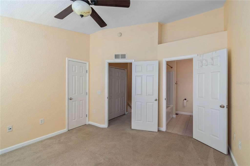 4814 Southwest 44th Circle Ocala, FL 34474 - Photo 24 of 40 a view of a livingroom with a ceiling fan & entryway