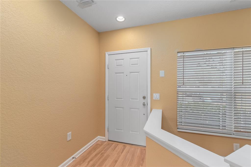 4814 Southwest 44th Circle Ocala, FL 34474 - Photo 5 of 40 a view of a hallway with wooden floor