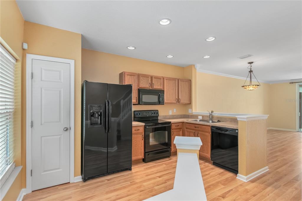 4814 Southwest 44th Circle Ocala, FL 34474 - Photo 6 of 40 a kitchen with granite countertop a refrigerator stove and oven