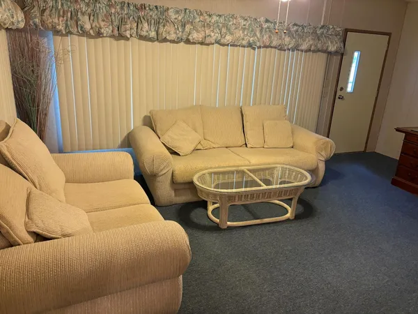 a bedroom with a bed and a mirror