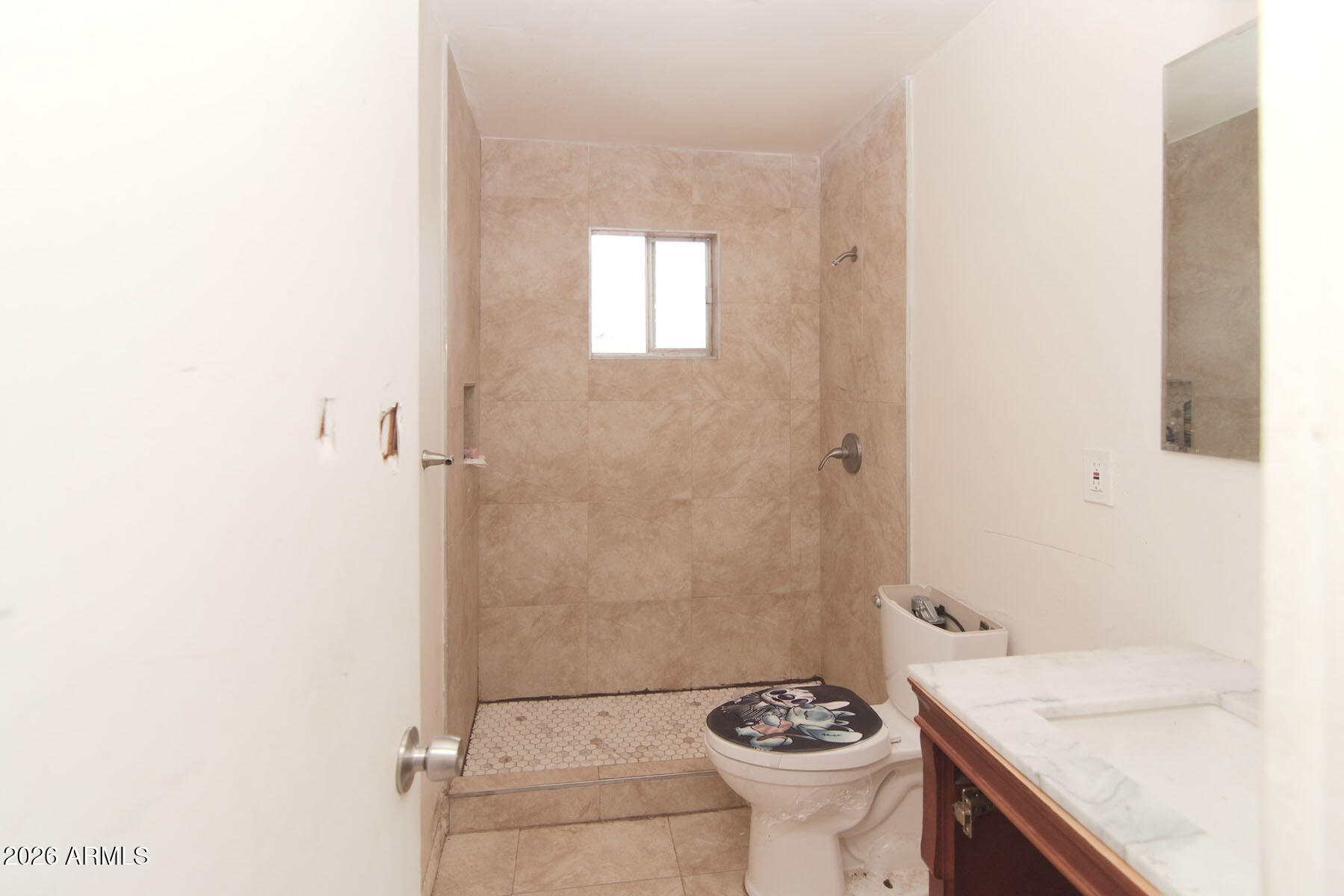 1176 North Royal Road Nogales, AZ 85621 - Photo 9 of 10 a bathroom with a sink a toilet and shower