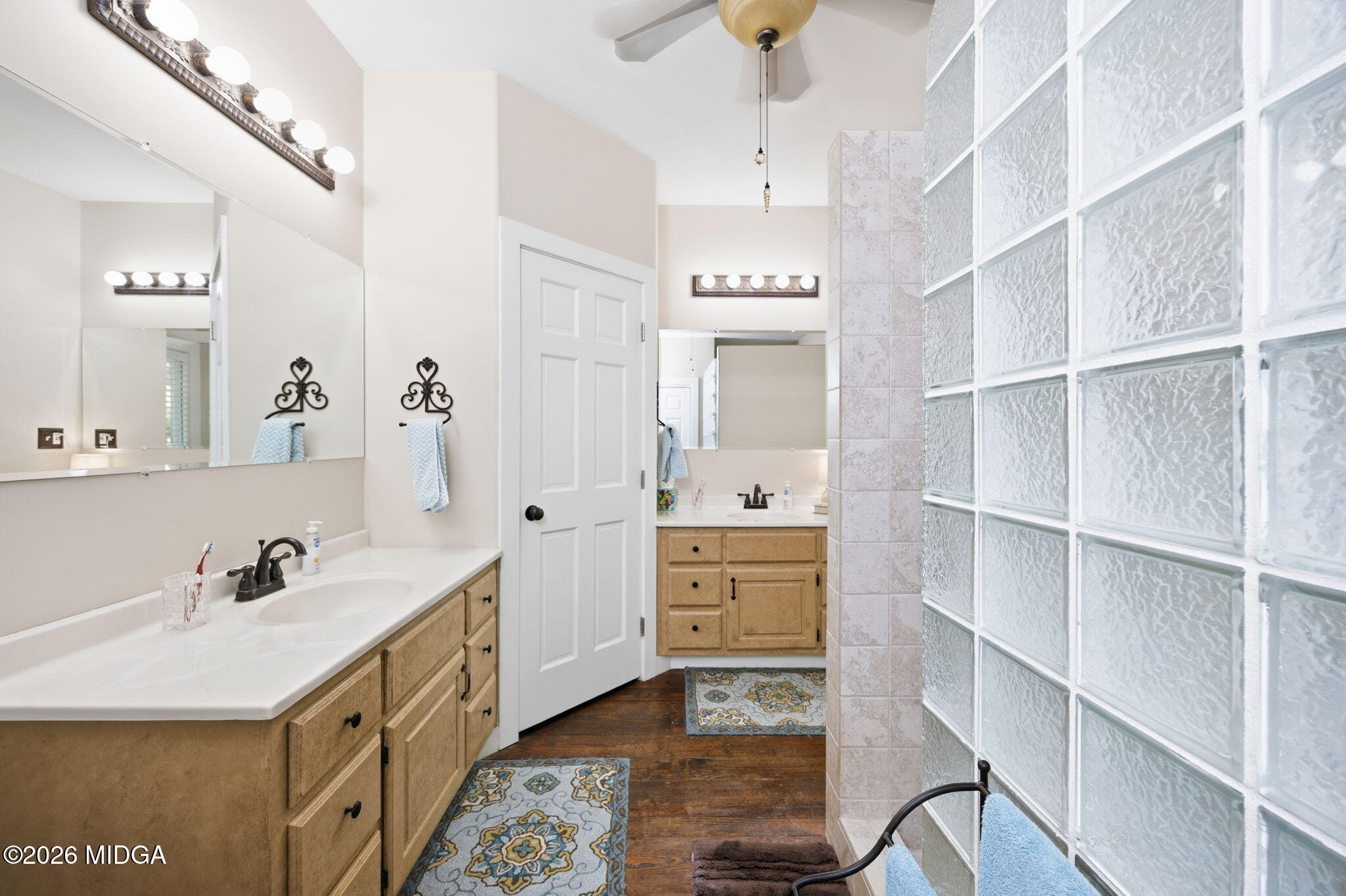 4686 Johnstonville Road Forsyth, GA 31029 - Photo 17 of 34 a spacious bathroom with a double vanity sink a mirror and a bathtub