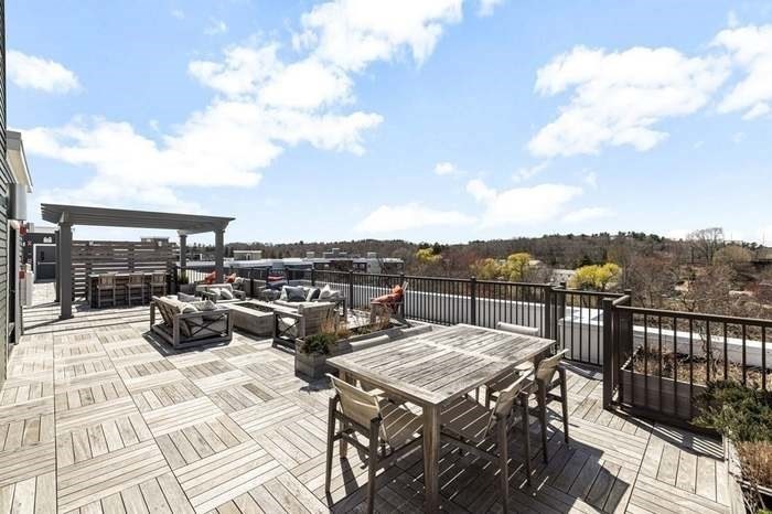 200 Revere Street, Unit 4209 Canton, MA 02021 - Photo 34 of 35 a view of a roof deck with couches
