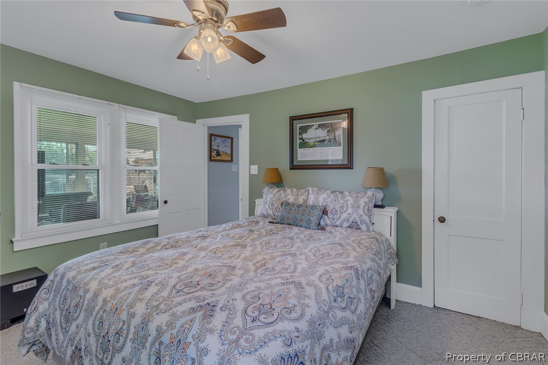 314 Callis Road Lancaster, VA 22503 - Photo 30 of 41 a bedroom with a bed and a window