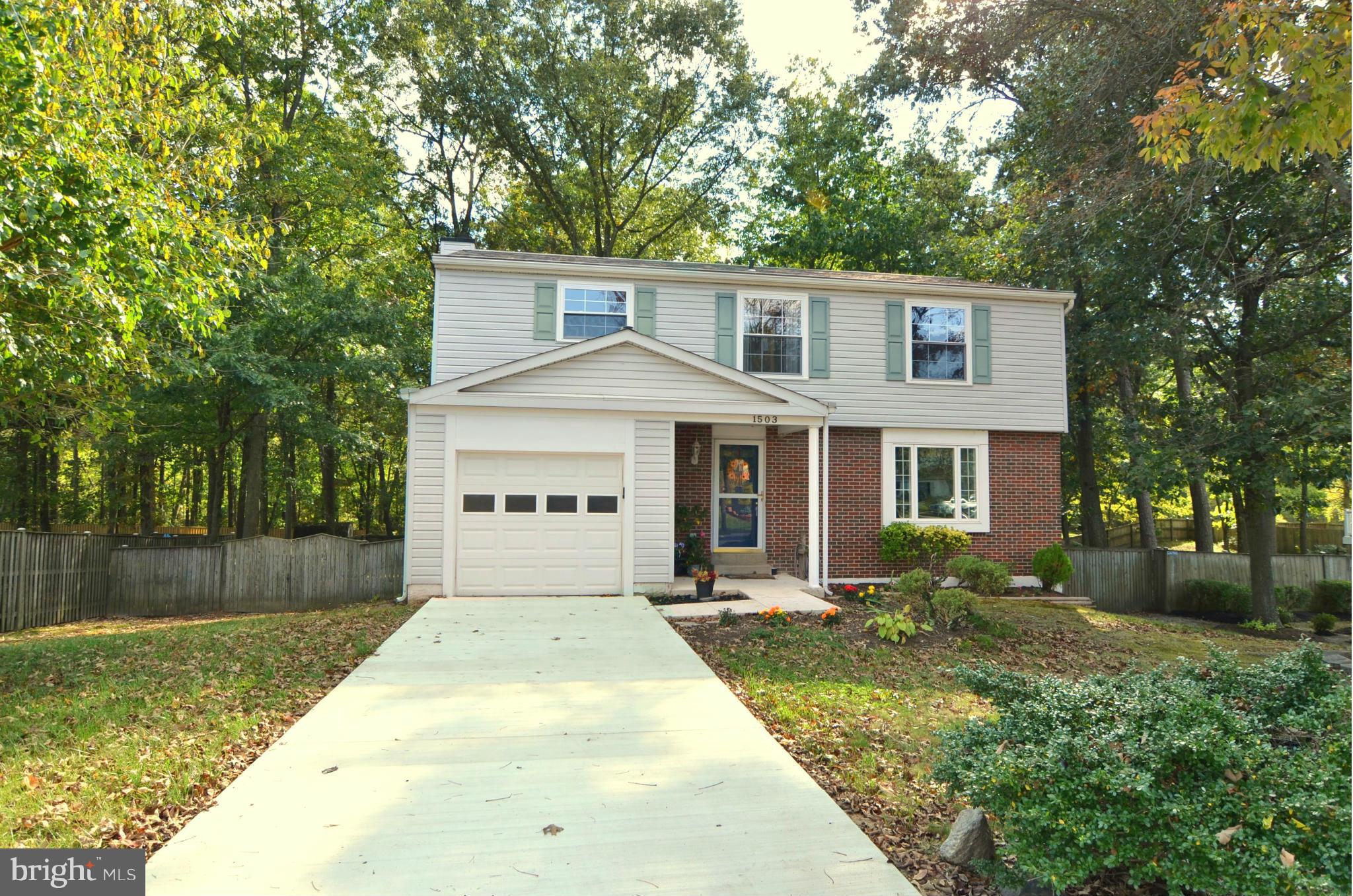 1503 Strider Court Hanover, MD 21076 - Photo 2 of 30 a front view of a house with a yard