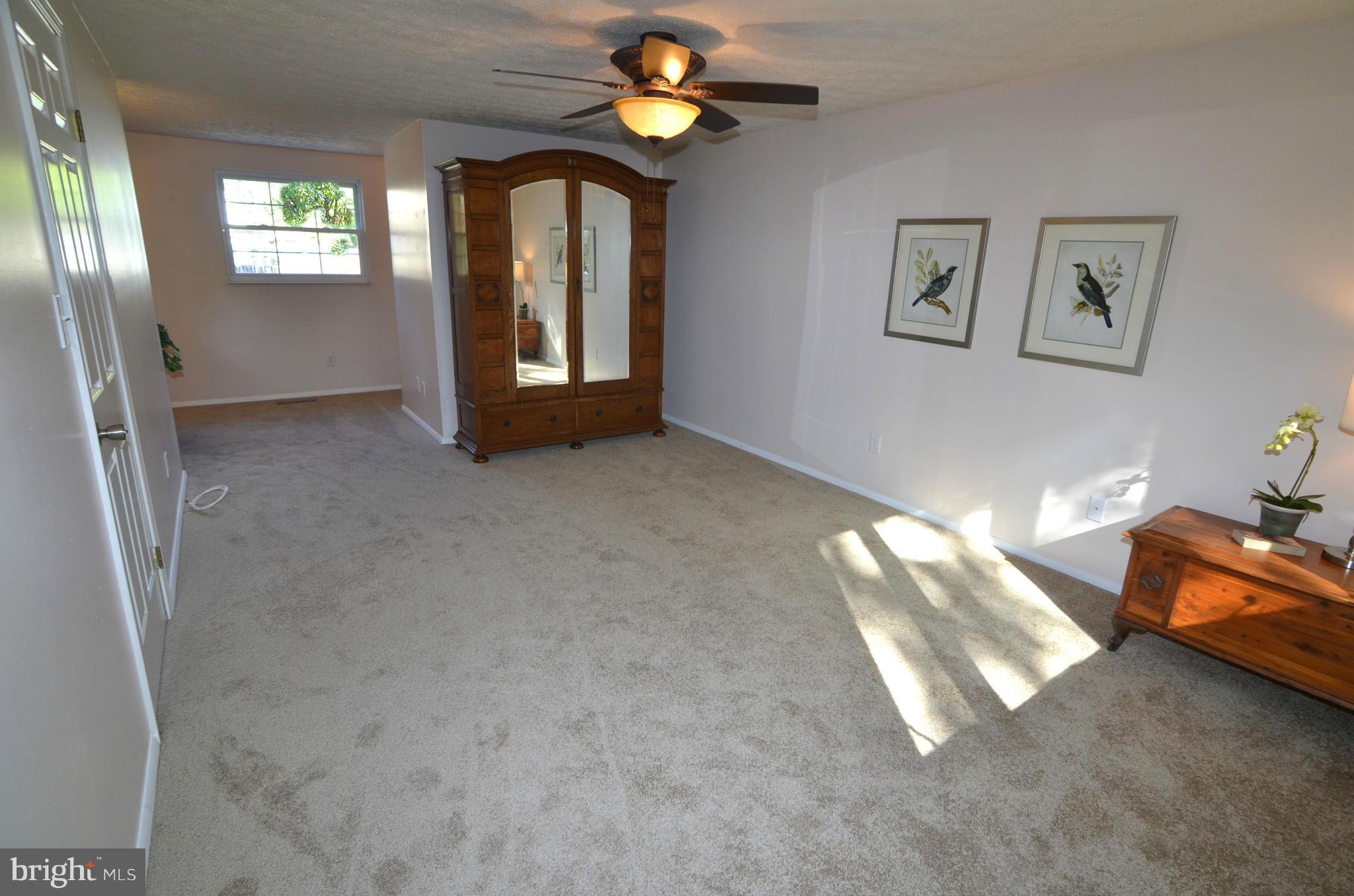 1503 Strider Court Hanover, MD 21076 - Photo 13 of 30 a view of an empty room with window and wooden floor