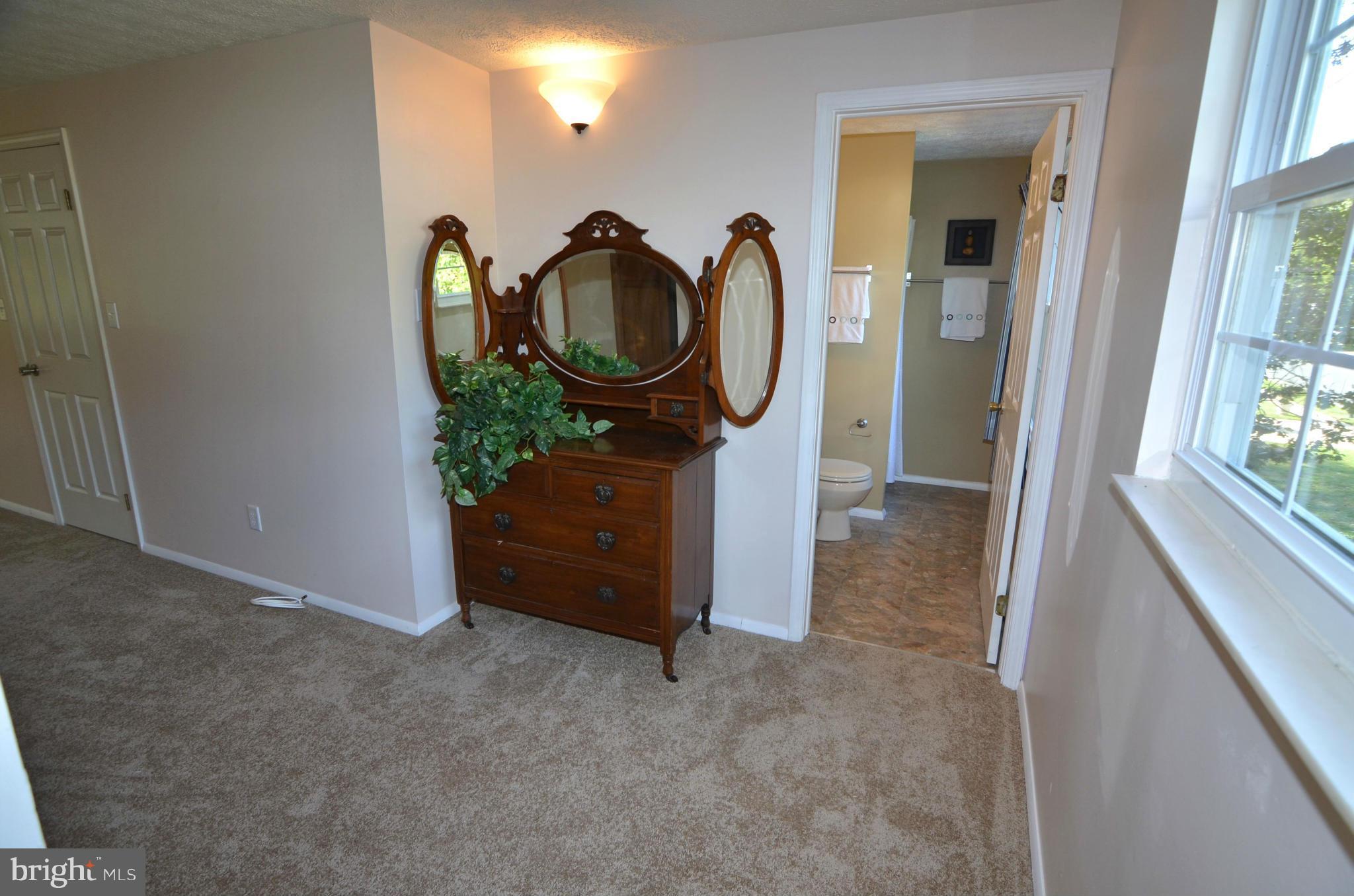 1503 Strider Court Hanover, MD 21076 - Photo 15 of 30 a room with closet and mirror