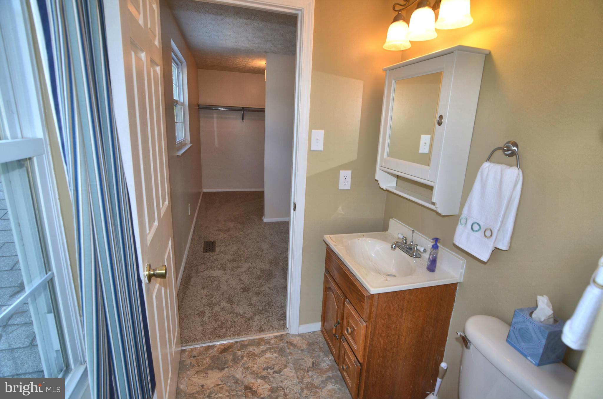 1503 Strider Court Hanover, MD 21076 - Photo 17 of 30 a bathroom with a sink vanity and mirror