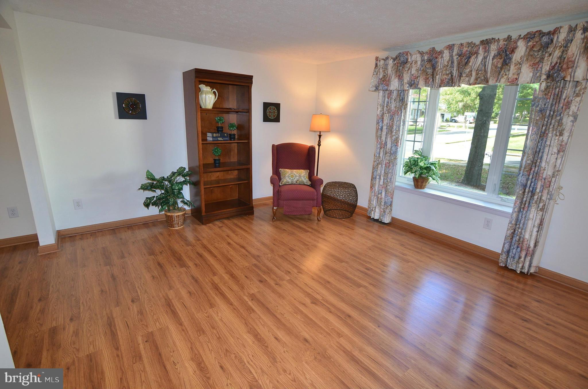 1503 Strider Court Hanover, MD 21076 - Photo 5 of 30 a room with furniture and a wooden floor