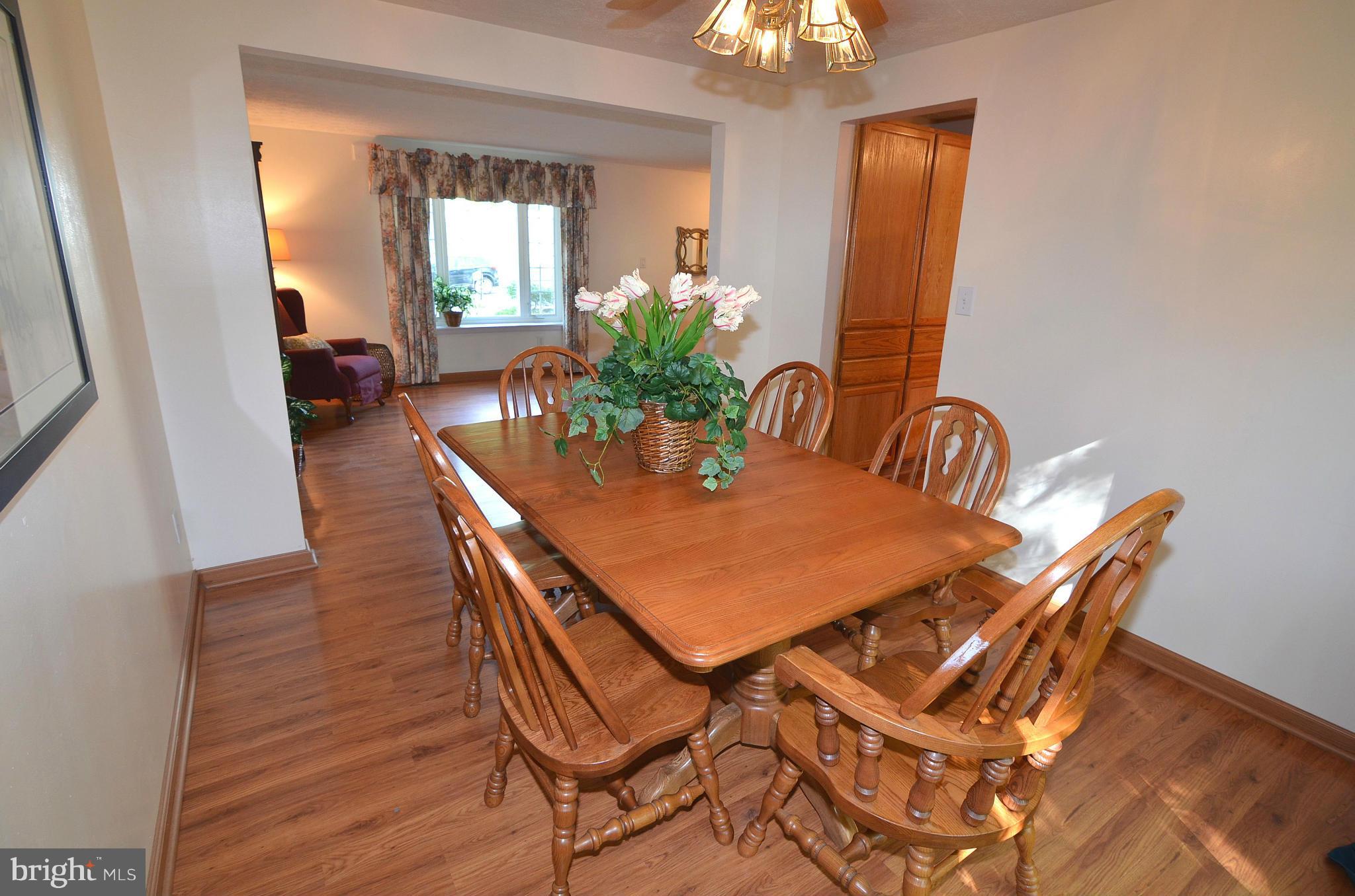 1503 Strider Court Hanover, MD 21076 - Photo 6 of 30 a view of a dining room with furniture and a chandelier