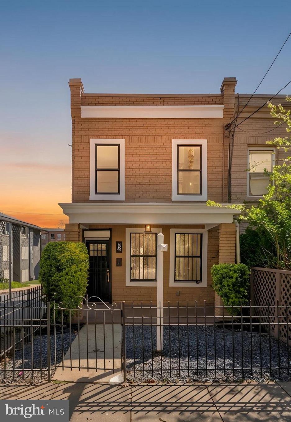 1845 Corcoran Street Northeast Washington, DC 20002 - Photo 1 of 33 Charming brick home at sunset glow.