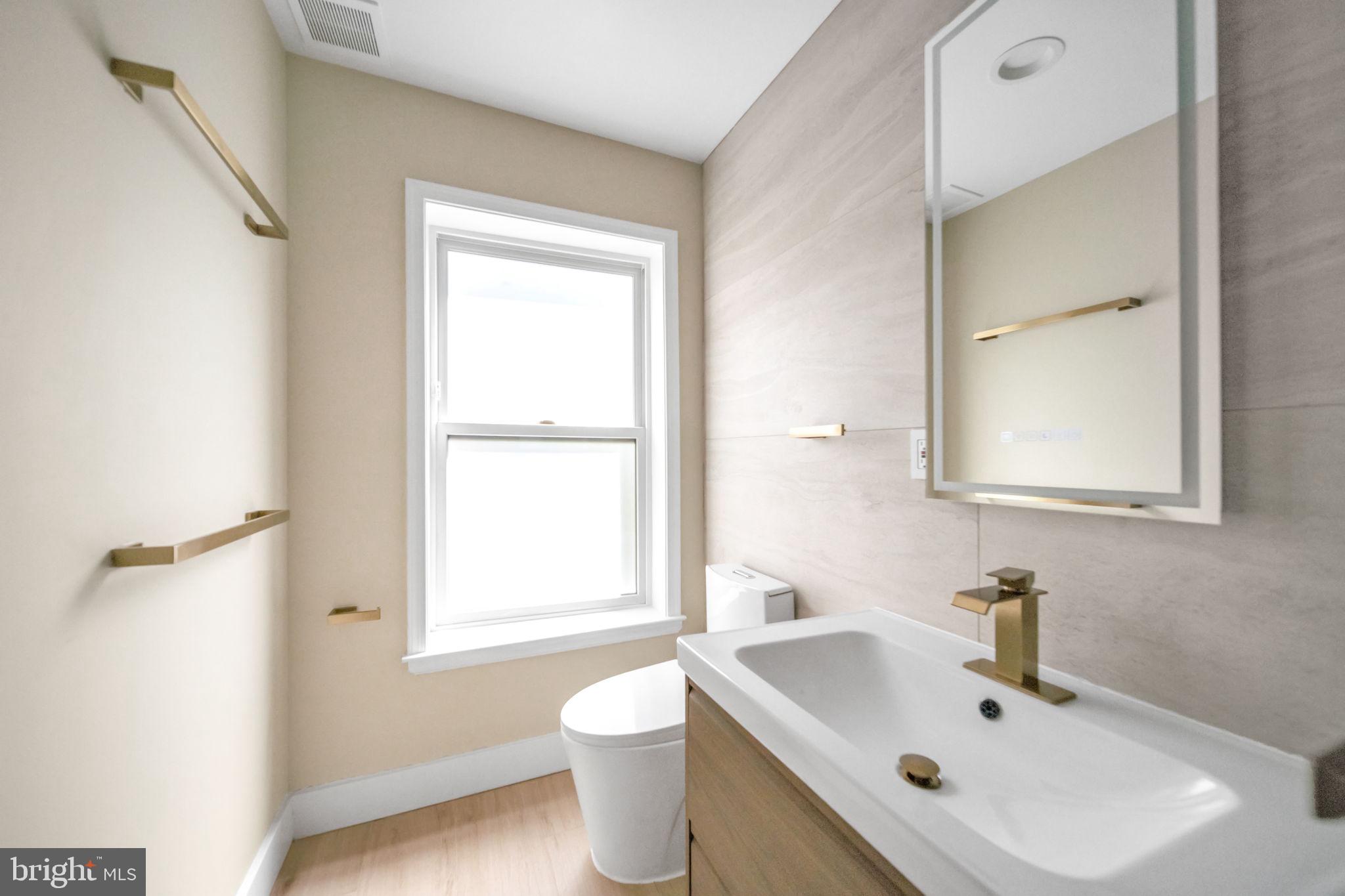 1845 Corcoran Street Northeast Washington, DC 20002 - Photo 21 of 33 Sleek modern bathroom with natural light.