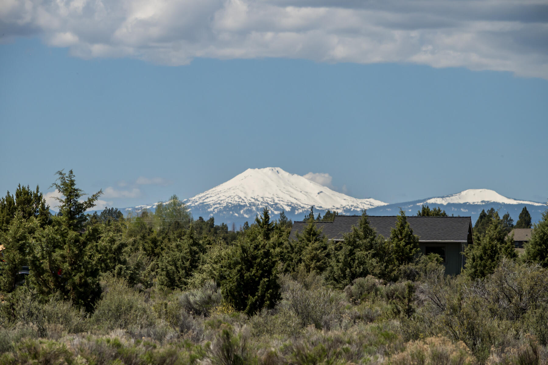 61030 Jennings Road Bend, OR 97702 - Photo 70 of 76 a view of a house with a yard and sitting area