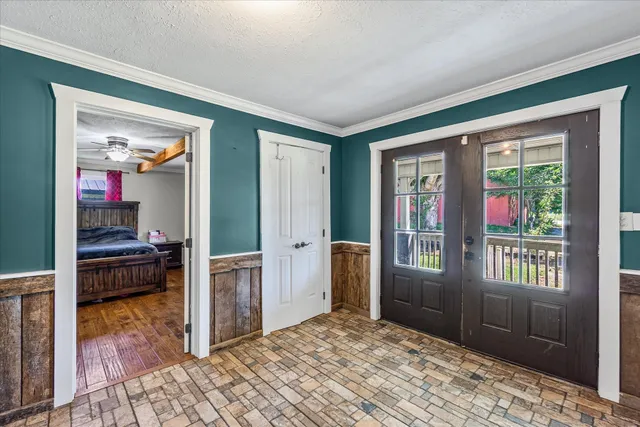 a bedroom with furniture and a window