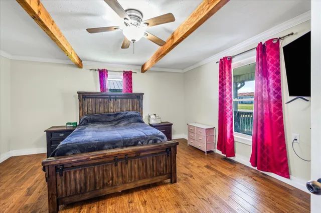 a bedroom with furniture and a chandelier