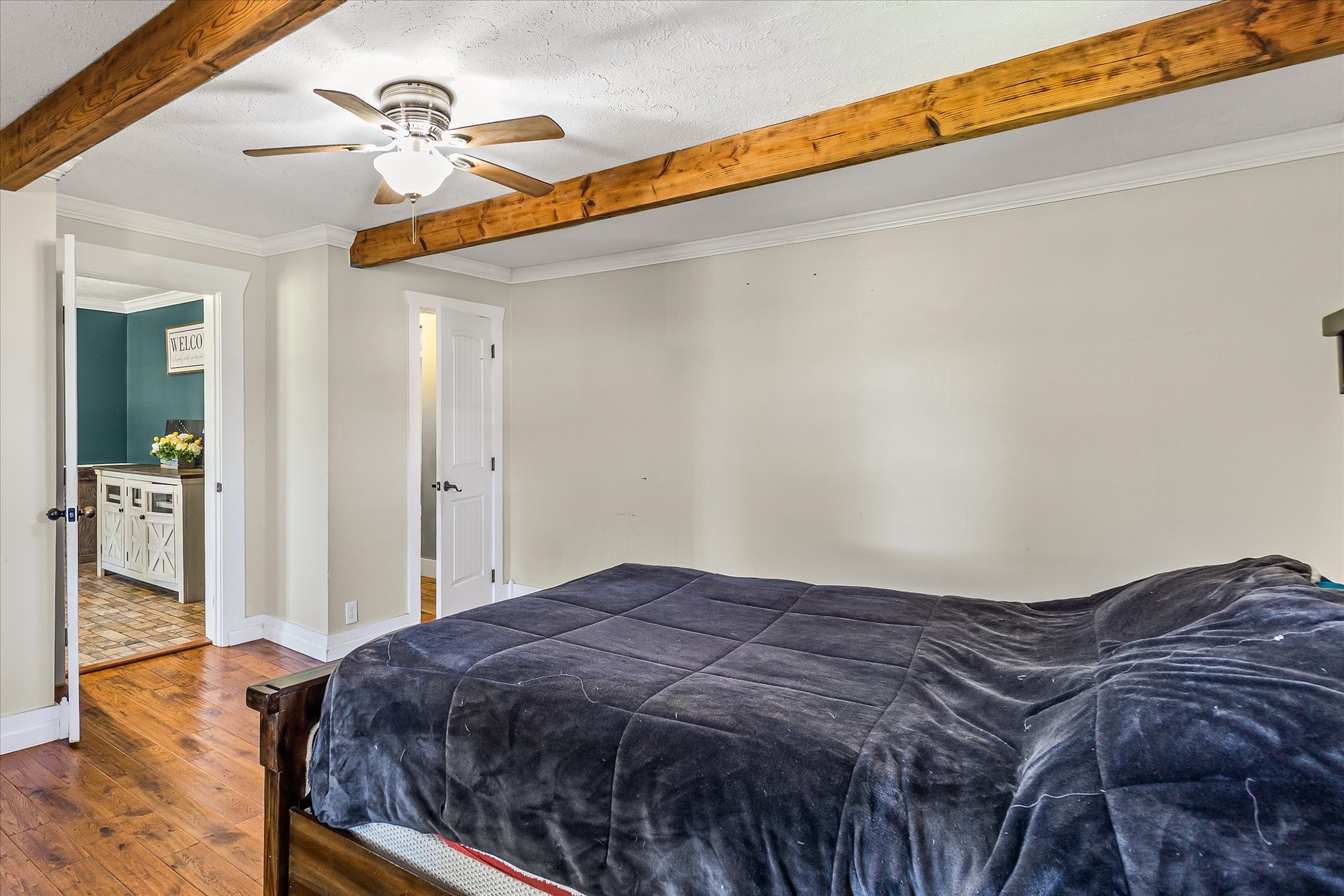 519 John McCoin Road Sparta, TN 38583 - Photo 16 of 27 a bedroom with a bed and wooden floor