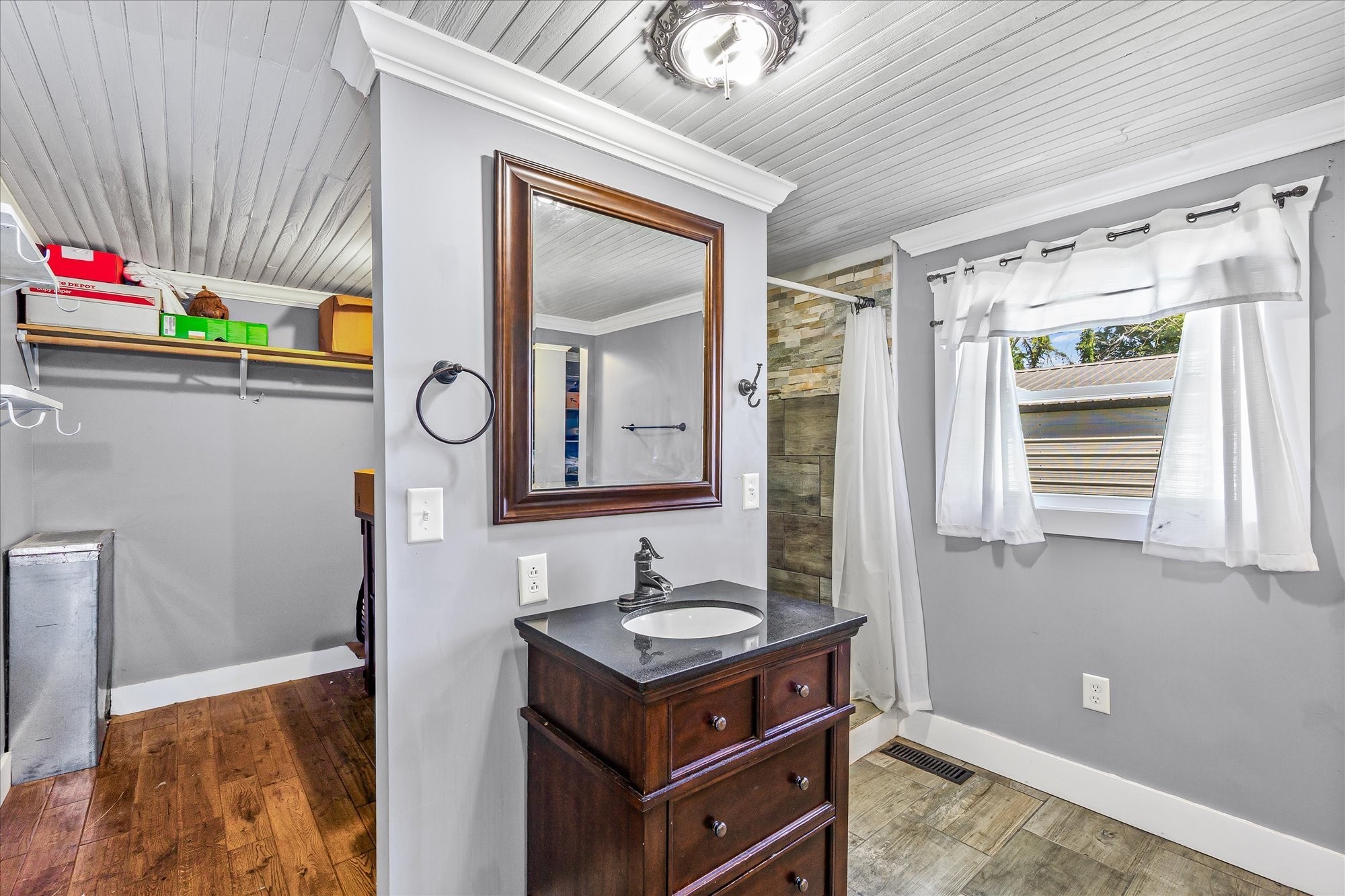 519 John McCoin Road Sparta, TN 38583 - Photo 19 of 27 a bathroom with a sink vanity granite and a mirror