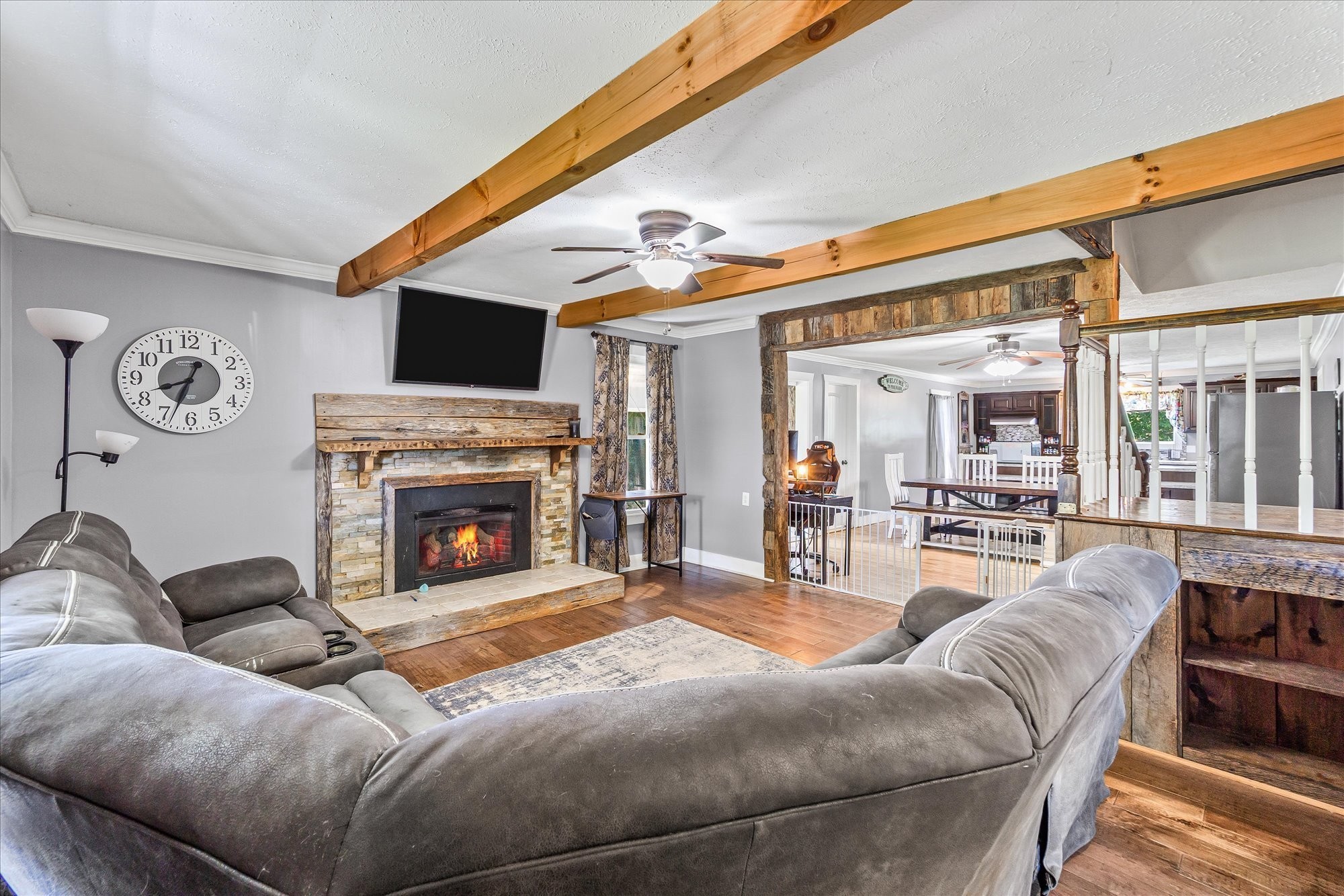 519 John McCoin Road Sparta, TN 38583 - Photo 21 of 27 a living room with furniture a fireplace and a flat screen tv