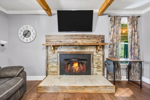 a living room with a fireplace and a fireplace