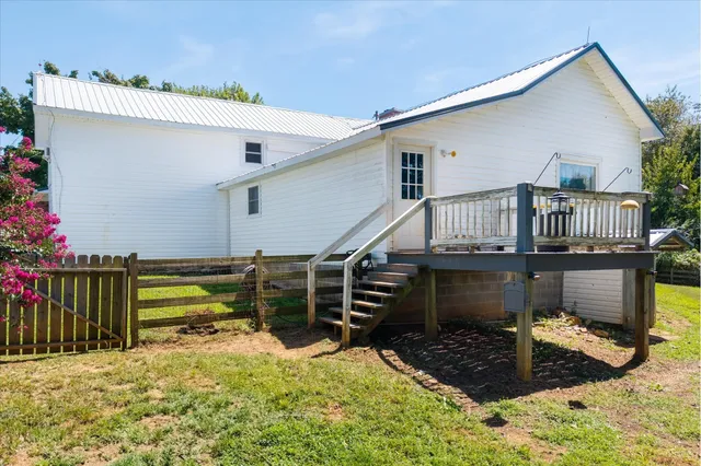 a front view of a house with wooden fence
