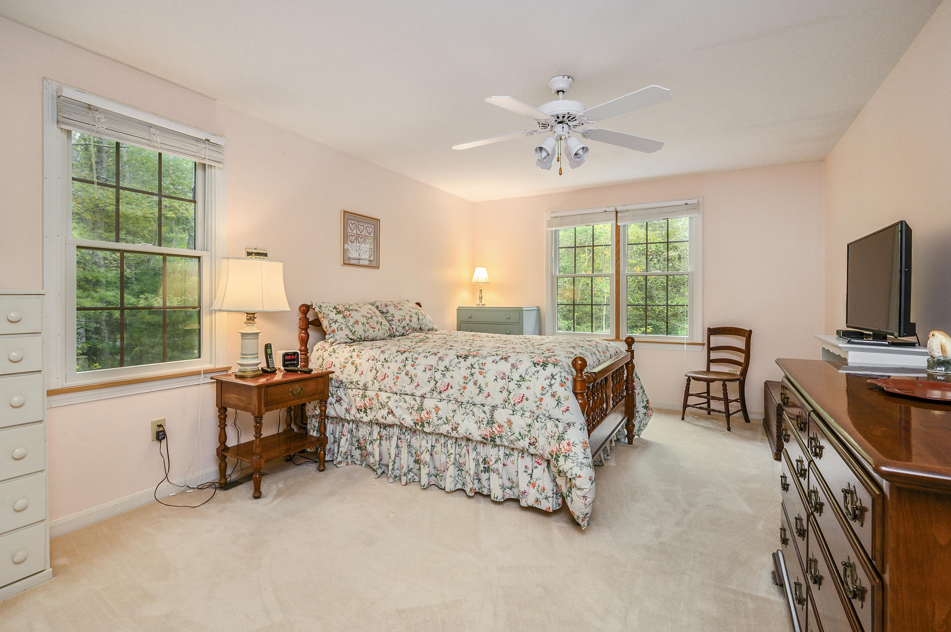 49 Hane Road Marstons Mills, MA 02648 - Photo 11 of 20 a bedroom with a bed and a chandelier