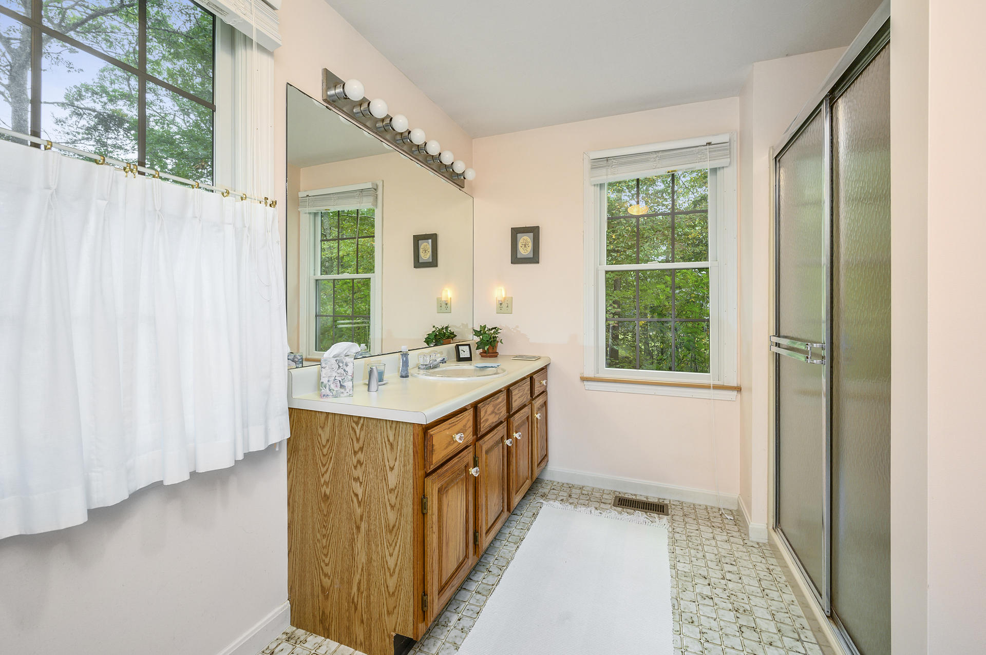 49 Hane Road Marstons Mills, MA 02648 - Photo 13 of 20 a bathroom with a granite countertop sink and a window