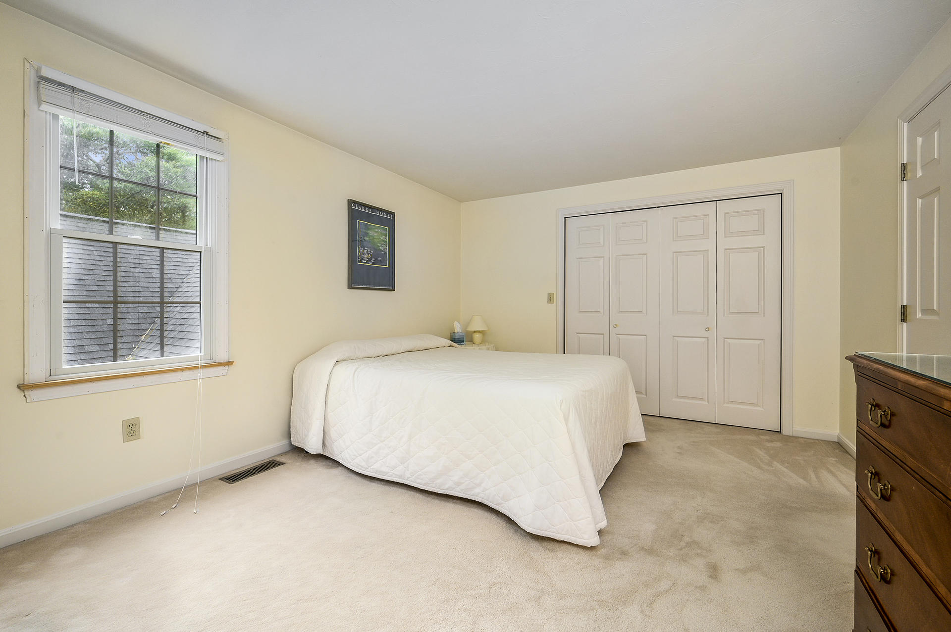 49 Hane Road Marstons Mills, MA 02648 - Photo 17 of 20 a spacious bedroom with a bed and a window