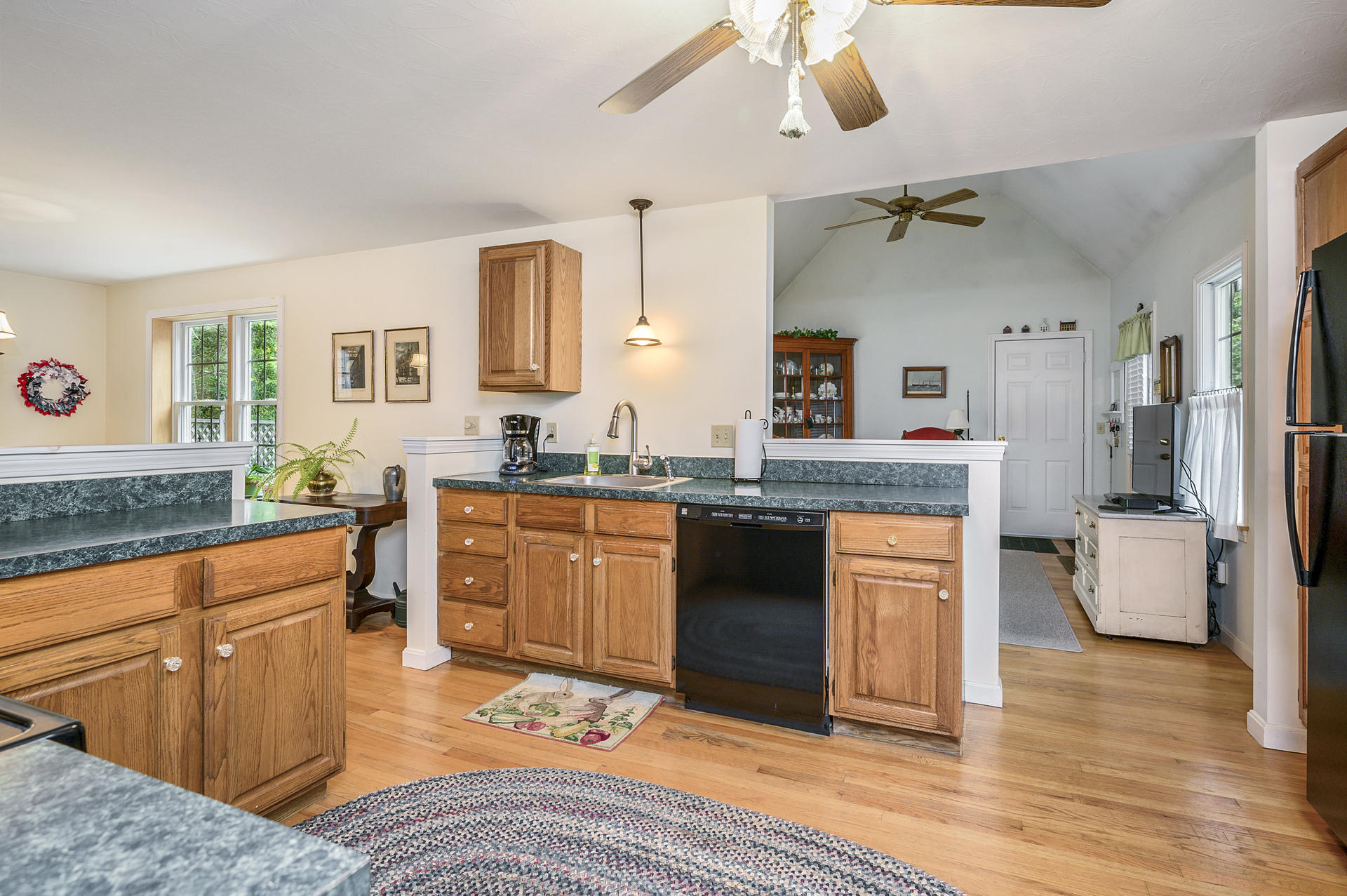 49 Hane Road Marstons Mills, MA 02648 - Photo 7 of 20 a kitchen with stainless steel appliances granite countertop a sink stove and refrigerator
