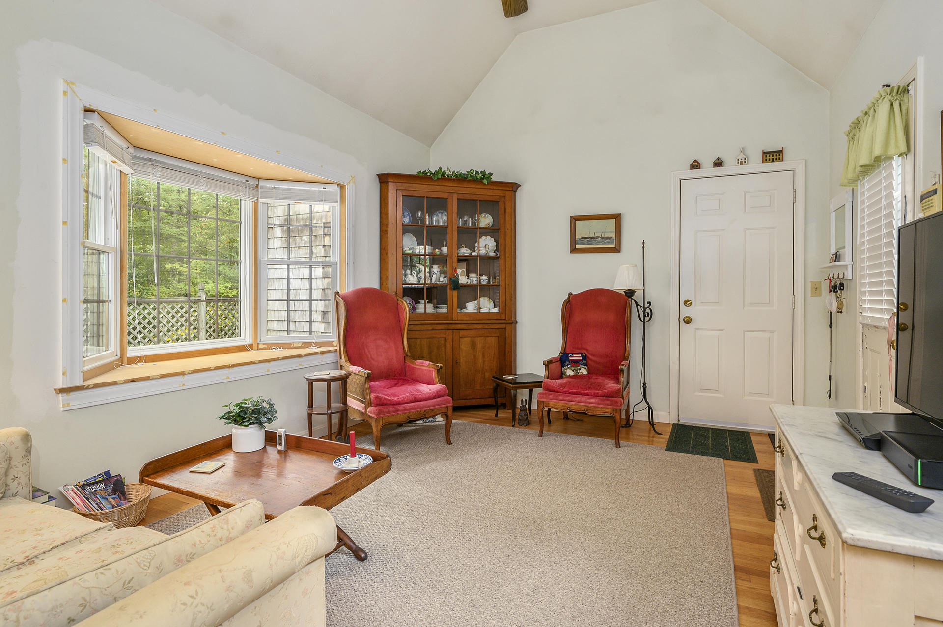 49 Hane Road Marstons Mills, MA 02648 - Photo 9 of 20 a living room with furniture toys and a window