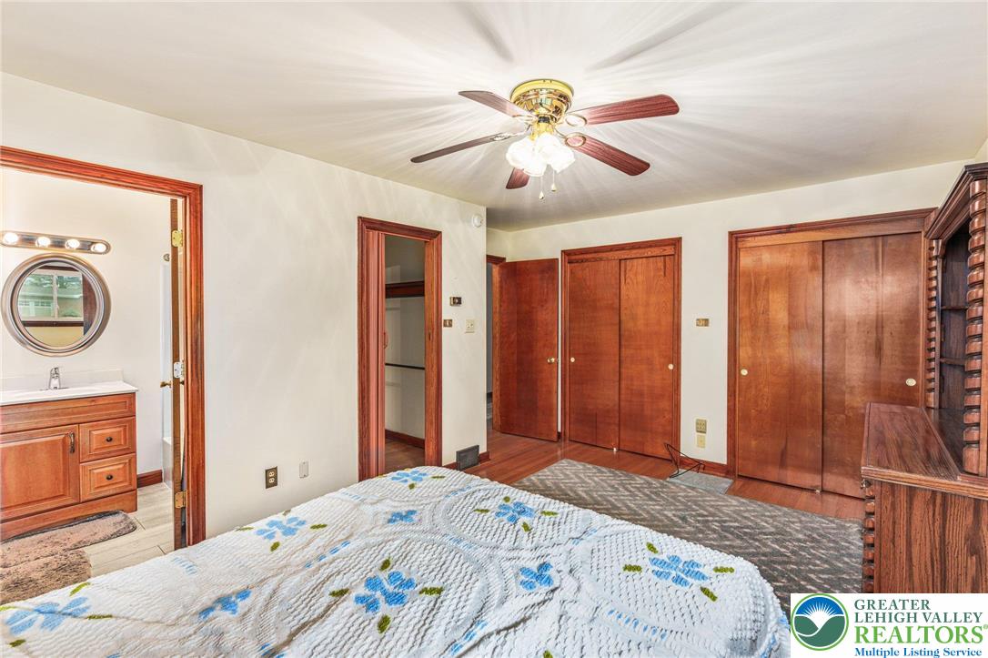 194 Gallagher Road Whitehall, PA 18052 - Photo 11 of 21 a bedroom with a bed and a chandelier