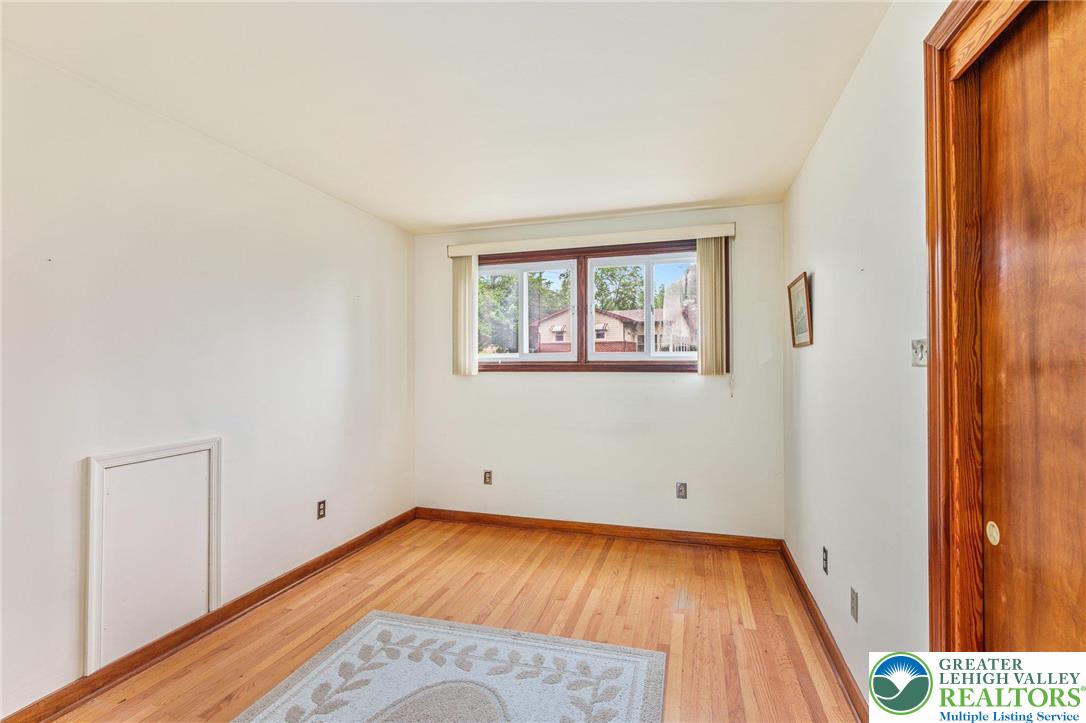 194 Gallagher Road Whitehall, PA 18052 - Photo 14 of 21 a view of a room with wooden floor and a window