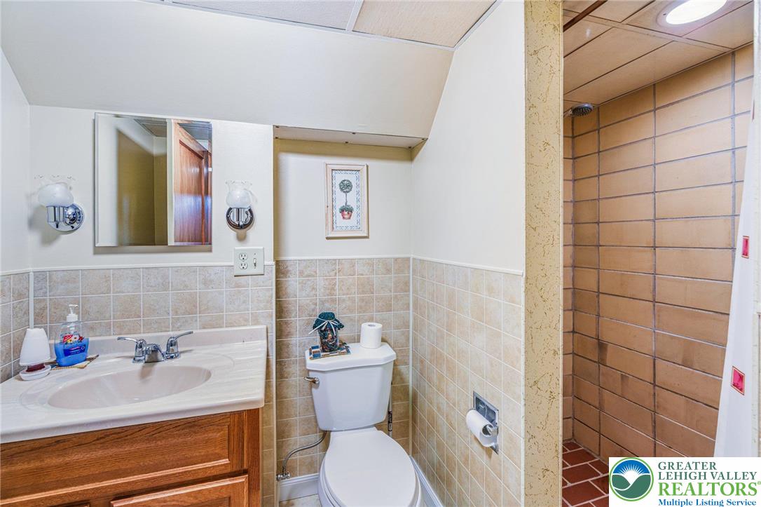 194 Gallagher Road Whitehall, PA 18052 - Photo 19 of 21 a bathroom with a sink mirror vanity and toilet