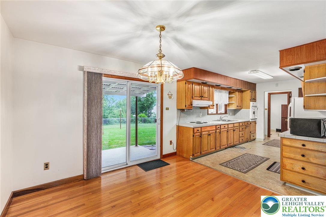 194 Gallagher Road Whitehall, PA 18052 - Photo 8 of 21 a kitchen with stainless steel appliances granite countertop a stove and a wooden floors
