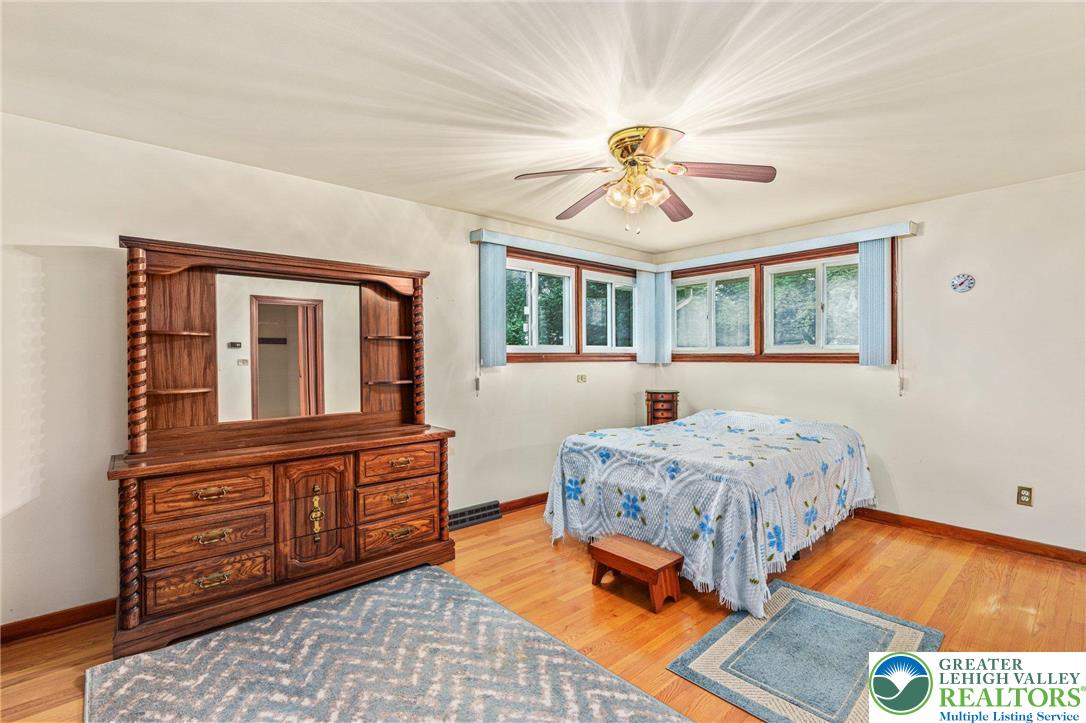 194 Gallagher Road Whitehall, PA 18052 - Photo 10 of 21 a bedroom with a bed and wooden floor