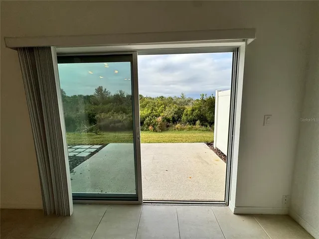 a view of a room that has a large window