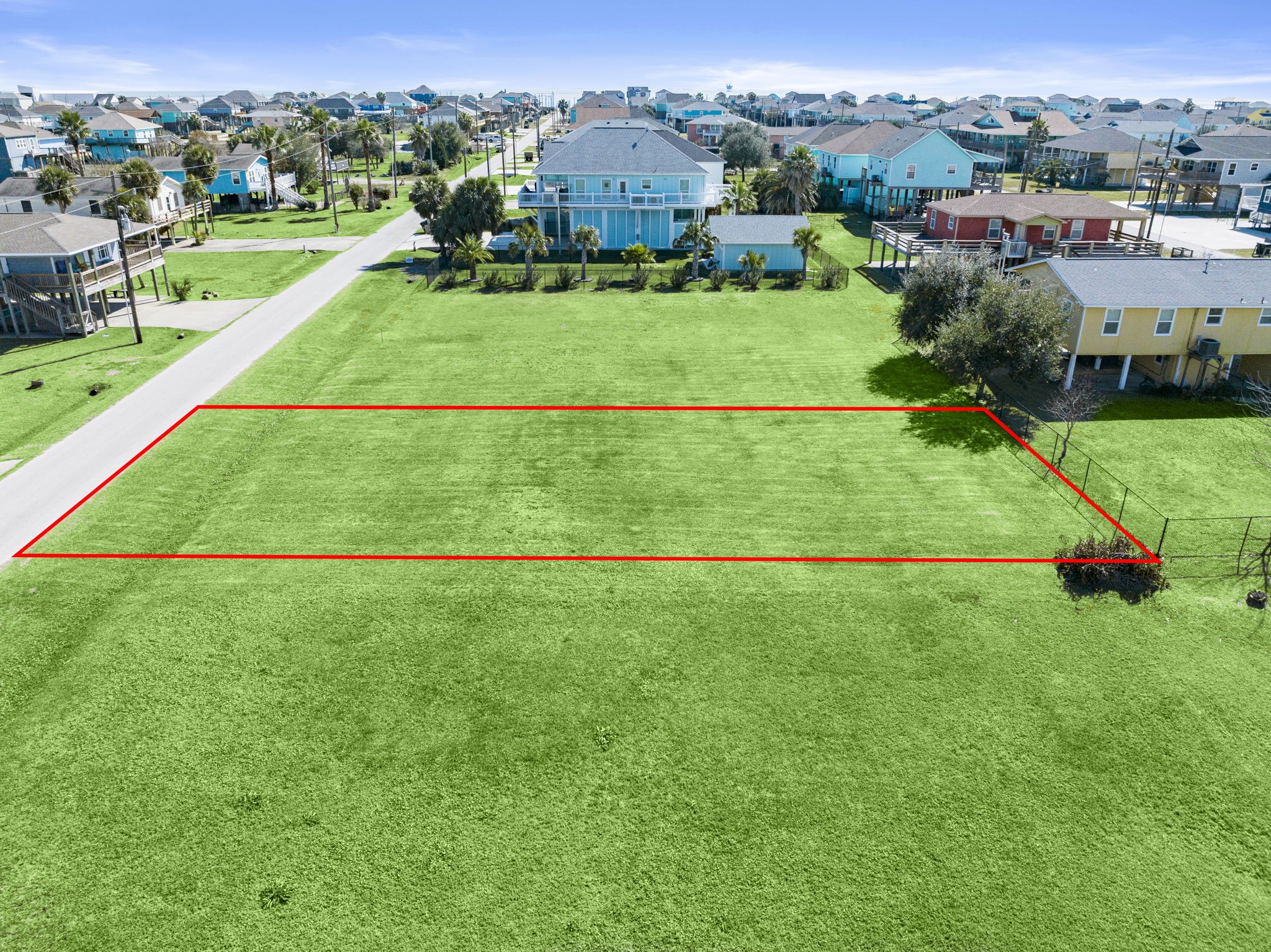 an aerial view of a houses with outdoor space and street view