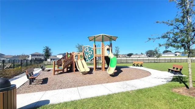 a view of a park with swings