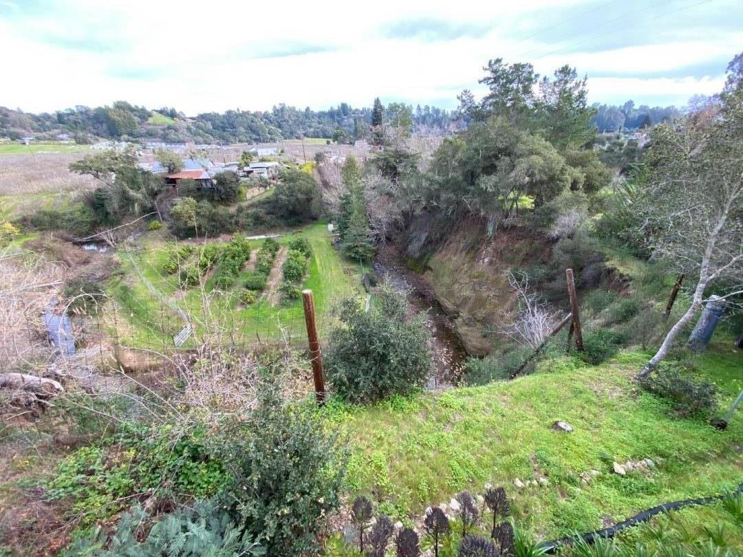 7 Vía Del Sol Watsonville, CA 95076 - Photo 19 of 21 a view of a lush green forest with trees and houses
