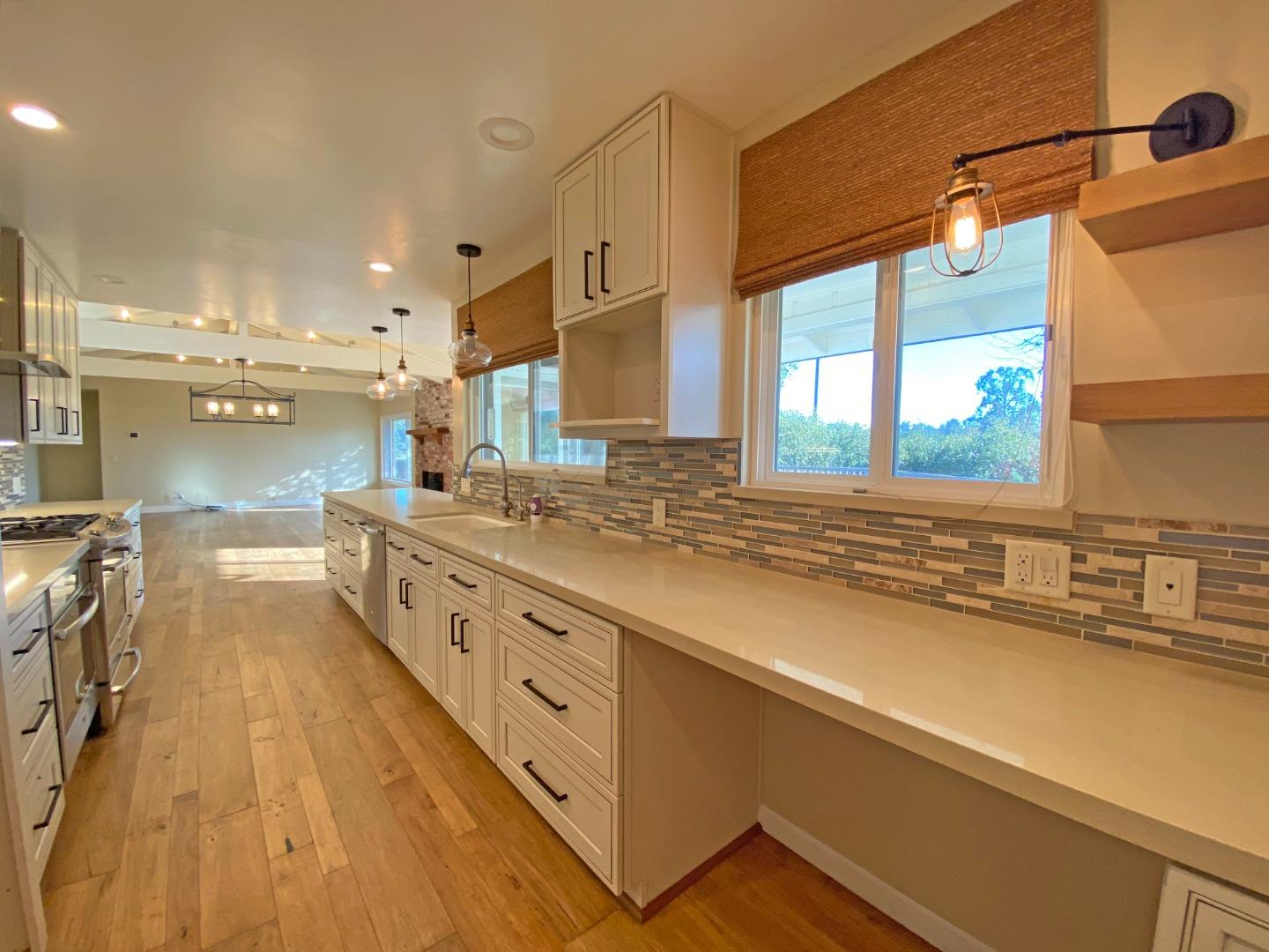 7 Vía Del Sol Watsonville, CA 95076 - Photo 4 of 21 a large kitchen with stainless steel appliances a lot of counter space and a sink