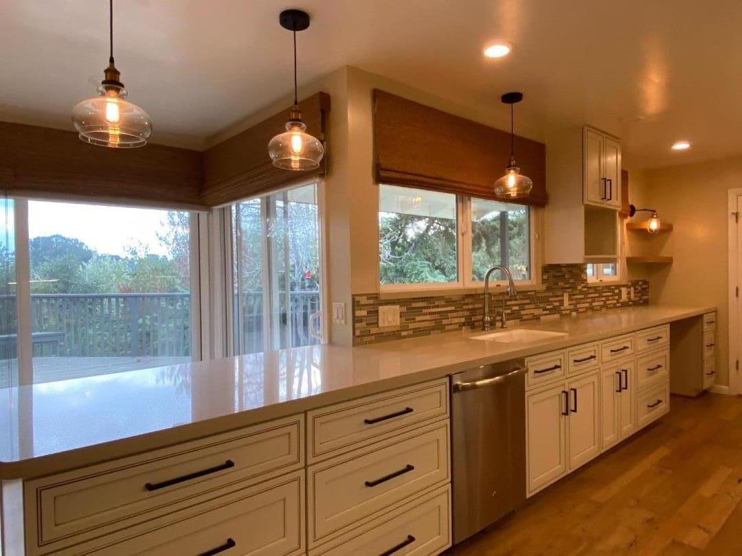 7 Vía Del Sol Watsonville, CA 95076 - Photo 5 of 21 a large kitchen with kitchen island granite countertop a large window and stainless steel appliances