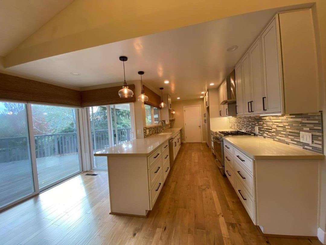 7 Vía Del Sol Watsonville, CA 95076 - Photo 6 of 21 a kitchen with counter top space and wooden floor