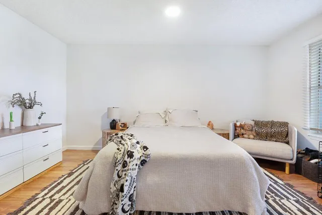 a bedroom with a bed and a dresser