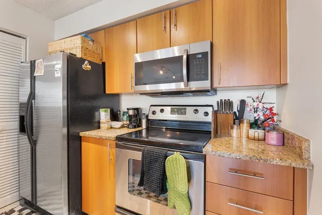 a kitchen with a stove and a microwave