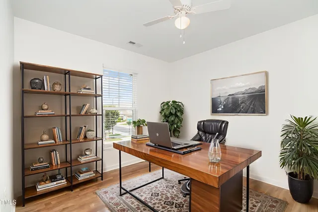 a bedroom with beds and painting on the wall